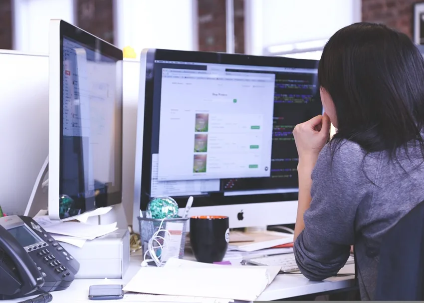Woman working on a digital marketing project on a laptop