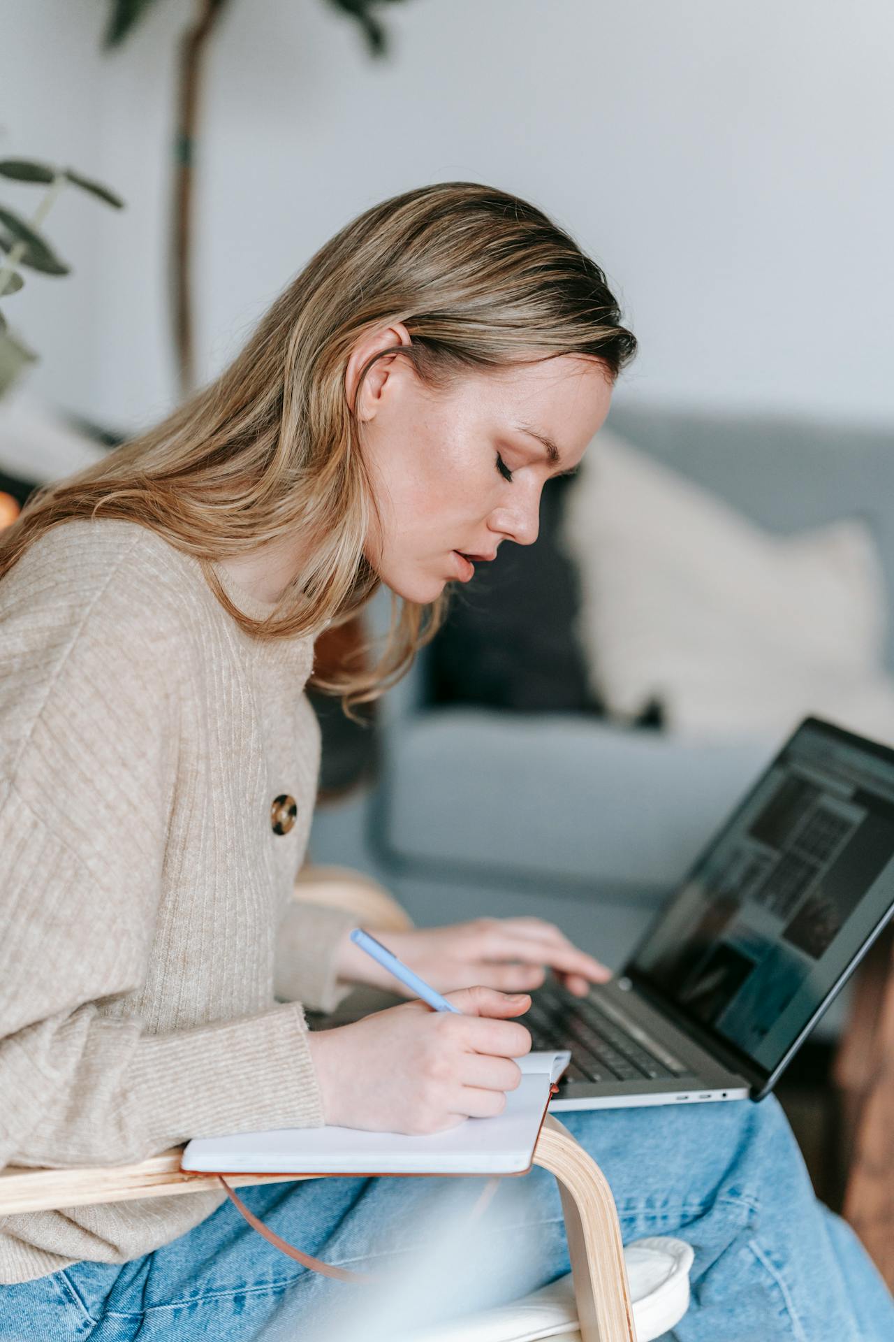 A Student Playbook for Pages That Rank: Local SEO image Student working with laptop and writing notes in planner